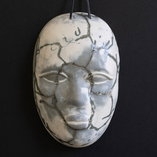 Grey and White Ceramic Mask